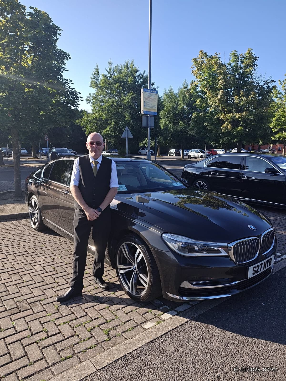 Serge, your chauffeur, beside the BMW 7 Series